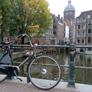 A bicycle by a canal
