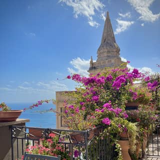 Flowers above the sea in Taormina